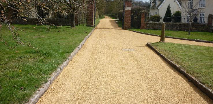 tar and chip lane leading to a house