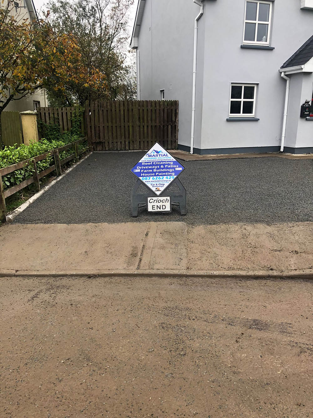Driveway after tar and chip surface