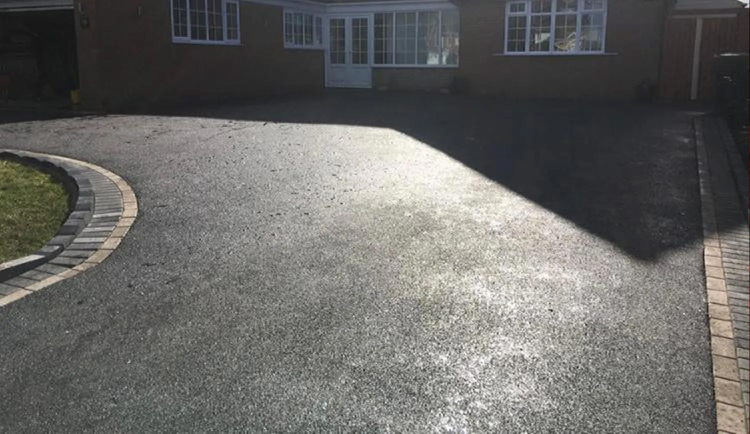 paved border and a tarmac driveway